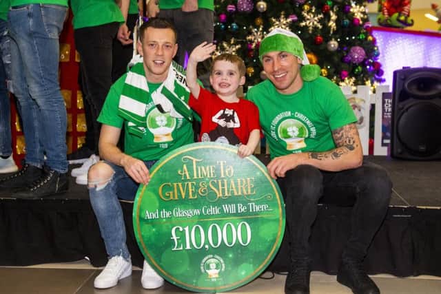 Callum McGregor, left, Celtic captain Scott Brown and four-year-old Mitchell Buchanan from Lenzie at Glasgow Childrens Hospital. Picture: Ross MacDonald/SNS