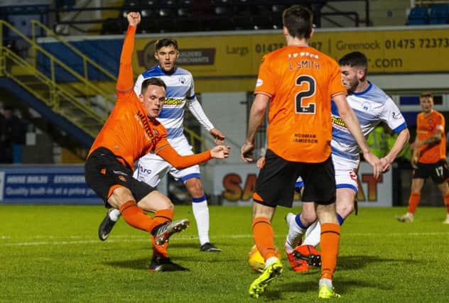 Lawrence Shankland slots the ball home to put Dundee United 2-1 ahead against Morton at Cappielow. Picture: Bruce White/SNS