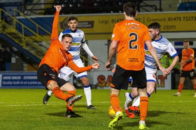 Lawrence Shankland slots the ball home to put Dundee United 2-1 ahead against Morton at Cappielow. Picture: Bruce White/SNS