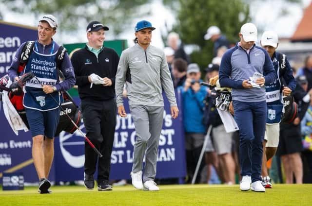 Rickie Fowler, centre, is flanked by Bob MacIntyre and Rory McIlroy in their headline group at this year's ASI Scottish Open. Picture: Bruce White/SNS
