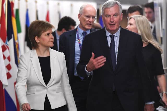 EU Chief negotiator for Brexit Michel Barnier (R) welcomes Scotland's Prime Minister Nicola Sturgeon at the European Commission in Brussels, on May 28, 2018 / AFP PHOTO / AFP PHOTO AND POOL / EMMANUEL DUNANDEMMANUEL DUNAND/AFP/Getty Images
