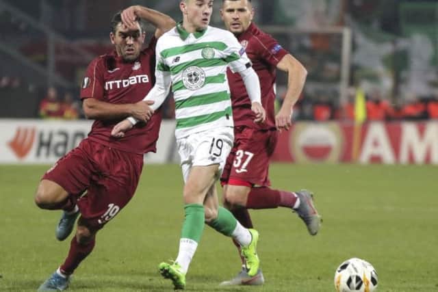 Mikey Johnston holds off Culio and Mihai Bordeianu at the Stadionul Dr. Constantin Radulescu