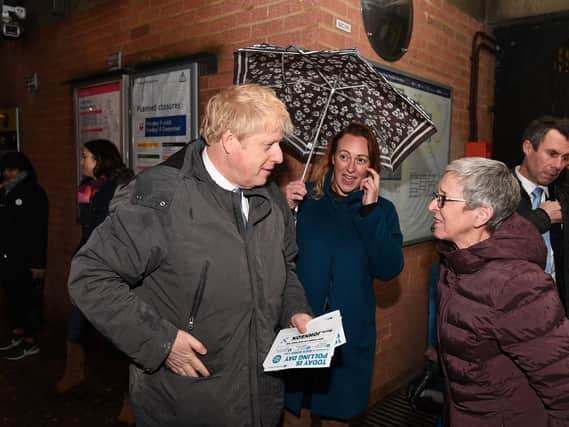 Boris Johnson speaks with constituents at South Ruislip station on election night