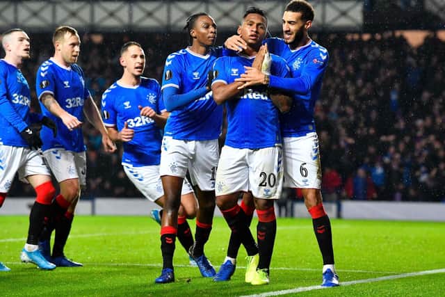 Alfredo Morelos is mobbed by his team-mates after netting the opener for Rangers