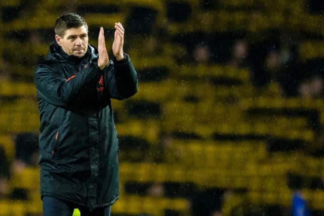 Steven Gerrard applauds the Rangers fans at full time