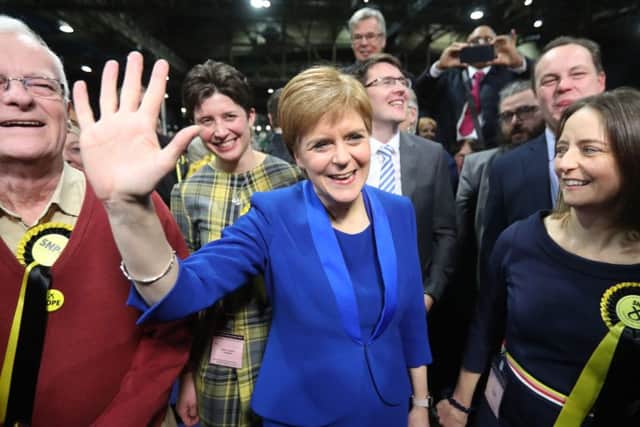 First Minister Nicola Sturgeon celebrates with supporters at the SEC Centre in Glasgow. Picture: PA