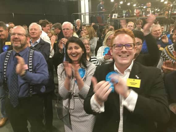 Conservative supporters cheer as candidate David Duguid holds onto Brexit-supporting Banff and Buchan.