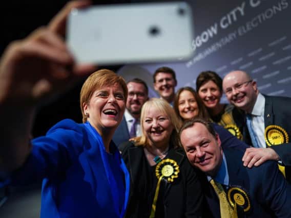 Celebrating too soon? Nicola Sturgeon takes a selfie with newly elected MPs at the general election count in Glasgow (Picture: Jeff J Mitchell/Getty)