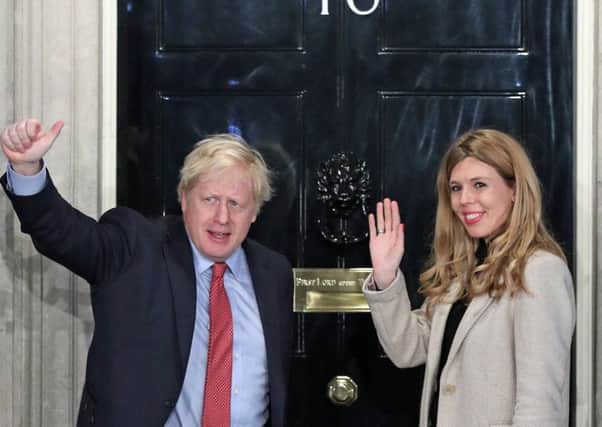 Boris Johnson and his girlfriend Carrie Symonds arrive in Downing Street after the Conservatives' general election victory (Picture: Yui Mok/PA Wire)