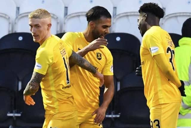 Livingston's Aymen Souda (centre) celebrates his opening goal against St Mirren. Picture: Rob Casey / SNS