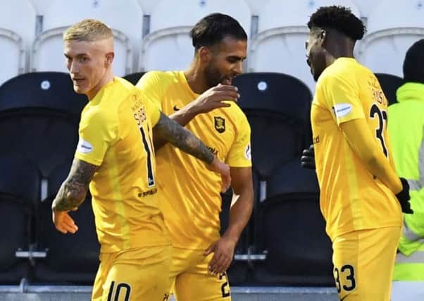 Livingston's Aymen Souda (centre) celebrates his opening goal against St Mirren. Picture: Rob Casey / SNS