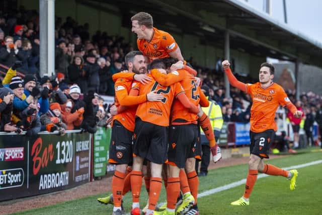 Dundee United's San Stanton celebrates his goal with teammates. Picture: Euan Cherry / SNS