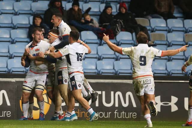 Edinburgh players show their delight at the final whistle after a hard-earned win in the Midlands. Photograph: Nigel French/PA