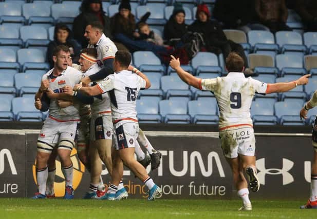 Edinburgh players show their delight at the final whistle after a hard-earned win in the Midlands. Photograph: Nigel French/PA