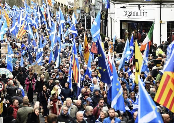 Independence supporters take part in an All Under One Banner rally in Edinburgh