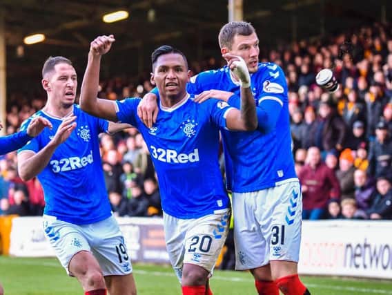 A cup of Bovril is thrown at Rangers' Alfredo Morelos as he celebrates scoring