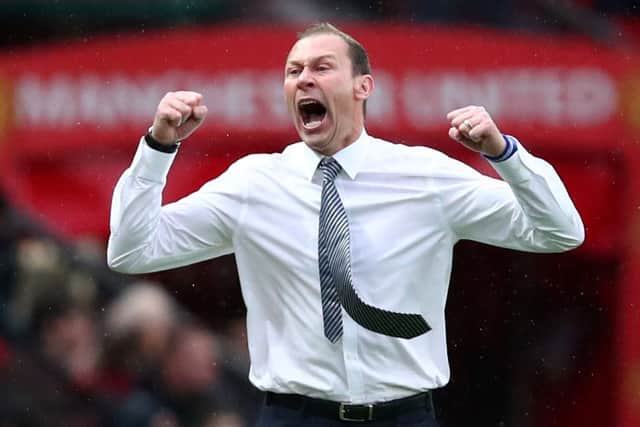 Evertons interim manager Duncan Ferguson raises his arms in jubilation as his team take the lead at Old Trafford. Picture: Getty.