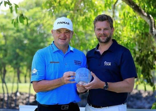 Paul Lawrie receives his Rookie of the Year trophy from Mark Aspland, head of the Staysure Tour.