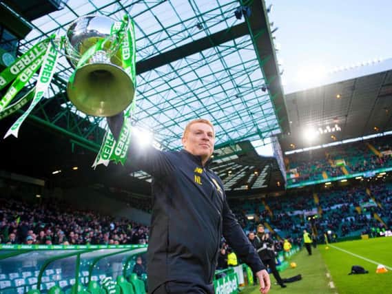 Neil Lennon parades the Betfred Cup ahead of the match with Hibs