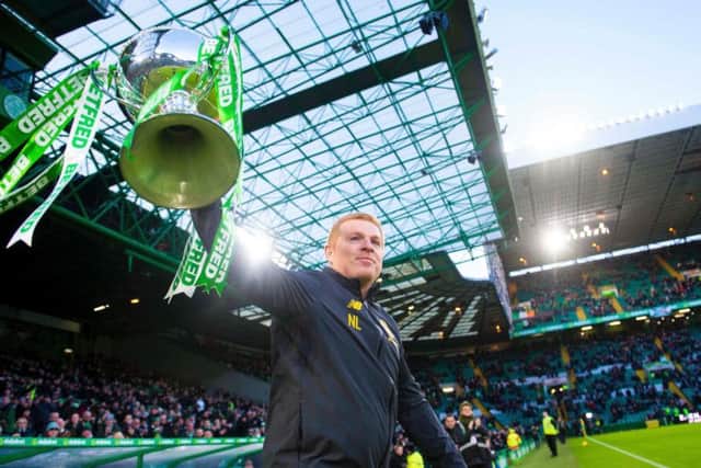 Neil Lennon parades the Betfred Cup ahead of the match with Hibs