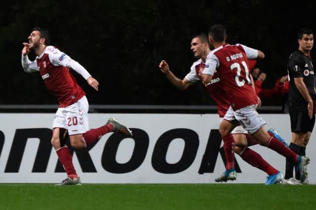 Sporting Braga's Portuguese forward Paulinho (L) celebrates after scoring a goal during the UEFA Europa League Group K football match between Sporting Braga and Besiktas, at the Municipal stadium of Braga, on November 7, 2019. (Photo by MIGUEL RIOPA / AFP) (Photo by MIGUEL RIOPA/AFP via Getty Images)