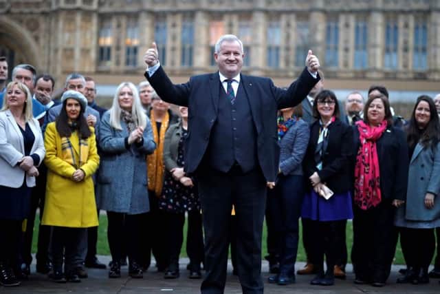 The SNP's Westminster leader Ian Blackford poses with the party's 47-strong group of MPs on Monday. Picture: Tolga Akmen/AFP