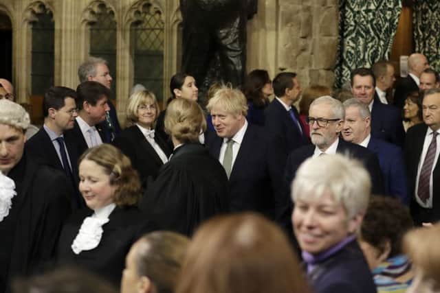Boris Johnson walks through the Commons members lobby for the State Opening of Parliament (Picture: Kirsty Wigglesworth/PA Wire)