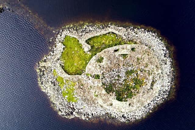 Dun Torcuill: Iron Age broch on loch in North Uist where a case of illegal excavation is being investigated. Picture: Contributed