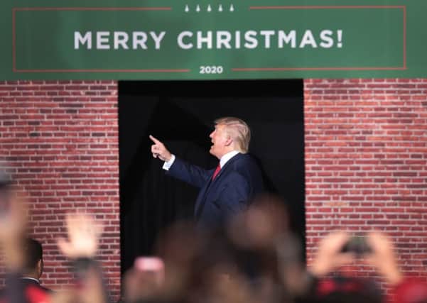 Donald Trump leaves his 'Merry Christmas Rally' in Battle Creek, Michigan, held as the US House of Representatives voted to impeach him. (Picture: Scott Olson/Getty Images)