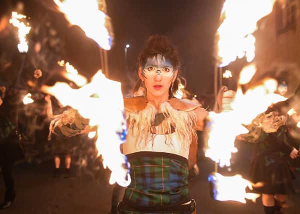 Performers from PyroCeltica lead the torchlight procession down Edinburgh's Royal Mile for the start of the Hogmanay celebrations on December 30 last year (Picture: Jeff J Mitchell/Getty Images)