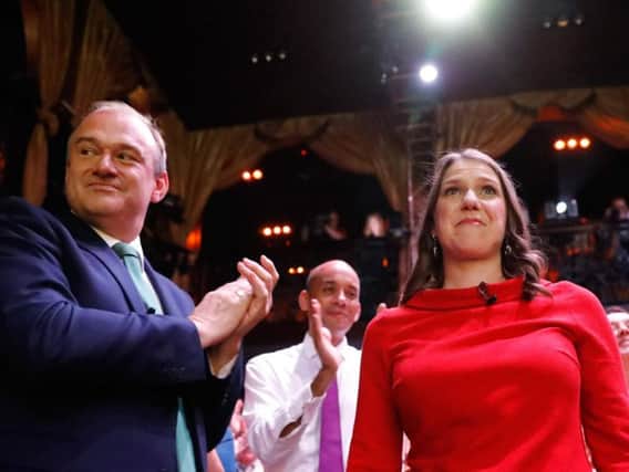 Sir Ed Davey (left) applauds Jo Swinson after she was announced as the leader of the Liberal Democrats