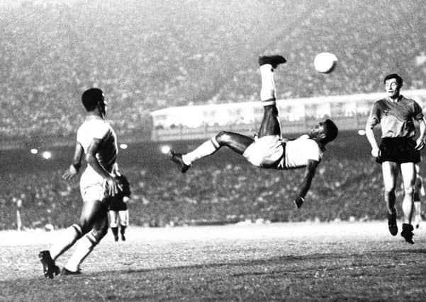 The young Kevan Christies footballing skills saw him share the nickname given to Edson Arantes do Nascimento, seen performing an overhead kick in 1968, in the playground  Pelé (Picture: AP)