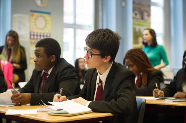 11/03/15. GLASGOW. St Rochâ¬"s High School, Royston. Stock shots, school , class , classroom , teacher , pupil , learn, student , school boy , school girl education.