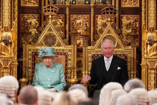 Queen Elizabeth II, seated alongside the Prince of Wales, ahead of delivering this morning's Queen's Speech