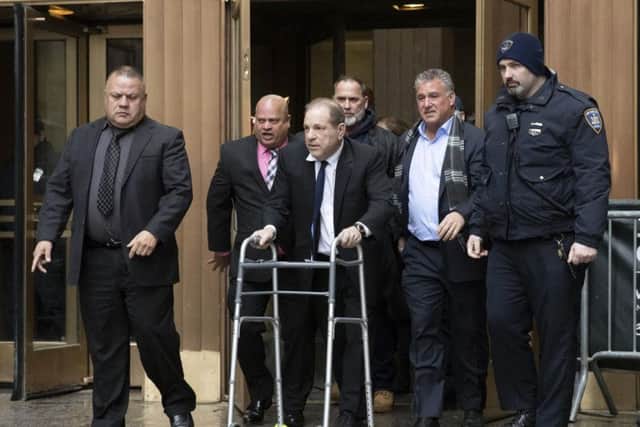 Harvey Weinstein, centre, leaves court following a hearing in New York on 11 December 2019. Picture: Getty