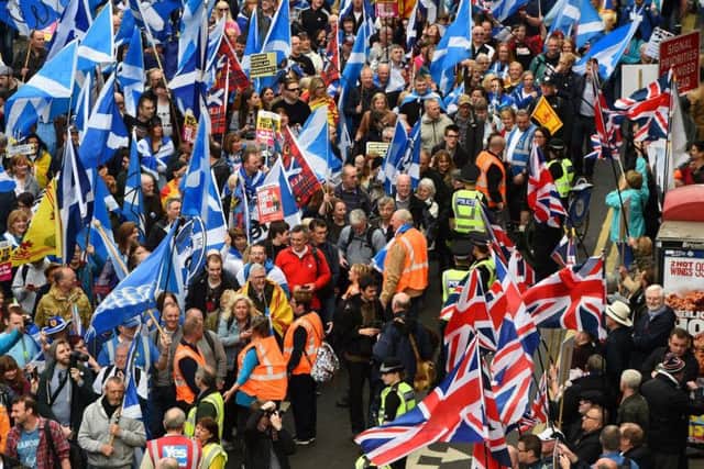 Independence supporters march past pro-Union demonstrators in Glasgow in May 2018. Picture: Andy Buchanan/AFP