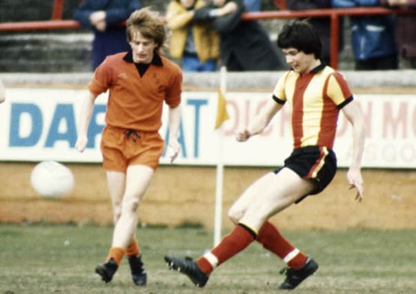 Graeme Payne, left, challenges for the ball with Partick Thistle's Alan Hansen in 1977. Picture: SNS