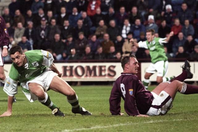 Hibs midfielder Pat McGinlay gets to his feet to celebrate after scoring in the Edinburgh New Year derby in 1998. Pic: SNS