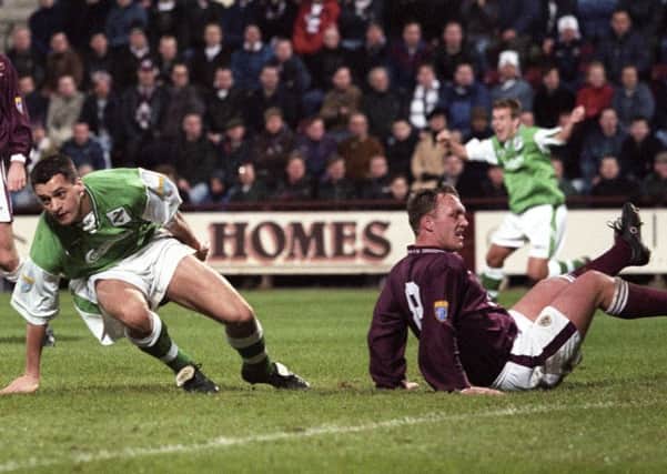 Hibs midfielder Pat McGinlay gets to his feet to celebrate after scoring in the Edinburgh New Year derby in 1998. Pic: SNS