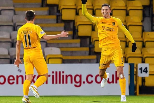 Lyndon Dykes celebrates scoring for Livingston.