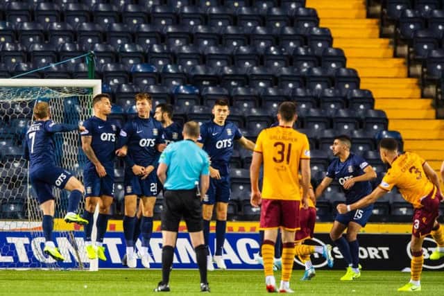 Jake Carroll puts Motherwell ahead.