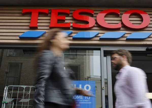 Supermarket giant Tesco has stopped production at a factory in China after one of its Christmas cards was found to contain a cry for help from a prisoner who made it. (Photo by TOLGA AKMEN/AFP via Getty Images)