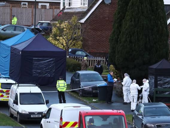 Emergency services were called to a house on Hazel Way, Crawley Down, on Sunday morning and found the two women outside and a man seriously injured inside.