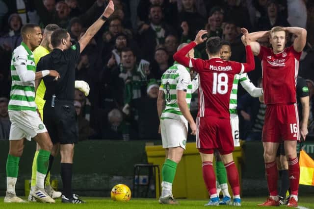 Aberdeen striker Sam Cosgrove, far right, can't believe Euan Anderson has shown him a red card during the Dons' 2-1 defeat by Celtic. Picture: Craig Williamson/SNS