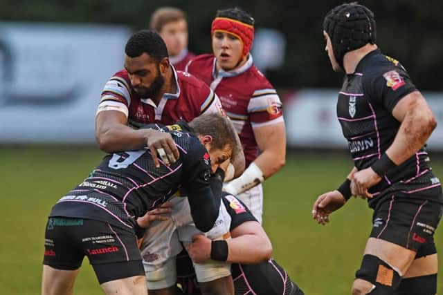 Watsonians try-scorer Mesu Kunavula is tackled by Bulls scrum-half David Armstrong on a bruising afternoon at Millbrae. Picture: Paul Devlin/SNS/SRU