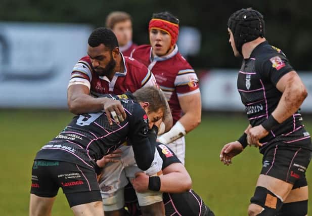 Watsonians try-scorer Mesu Kunavula is tackled by Bulls scrum-half David Armstrong on a bruising afternoon at Millbrae. Picture: Paul Devlin/SNS/SRU