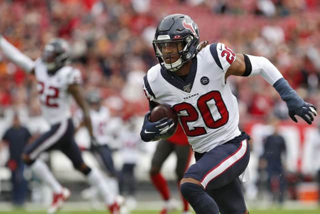 Houston Texans safety Justin Reid runs with the ball after intercepting a pass by Tampa Bay Buccaneers quarterback Jameis Winston. Picture: Mark LoMoglio/AP