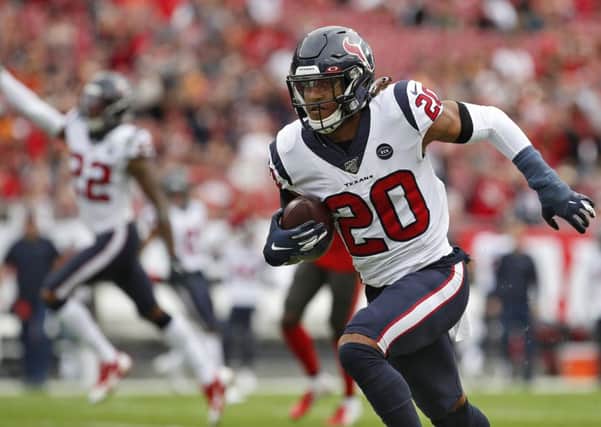 Houston Texans safety Justin Reid runs with the ball after intercepting a pass by Tampa Bay Buccaneers quarterback Jameis Winston. Picture: Mark LoMoglio/AP