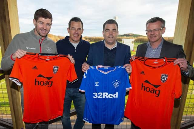 Manager Steven Gerrard, left, and managing director Stewart Robertson, right, help launch the partnership.
