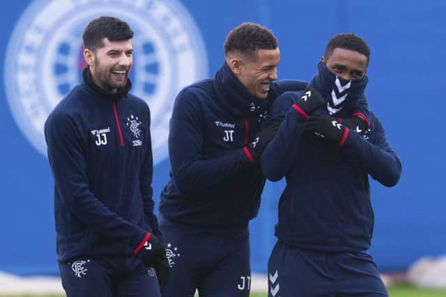 Jordan Jones, left, enjoys a lighter moment during Rangers  training session with team-mates James Tavernier and Jermain Defoe. Picture: SNS.